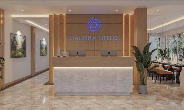 A hotel reception desk with a modern design, featuring a logo above the name 'HALORA HOTEL'.