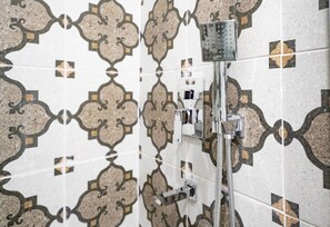 A shower with a modern design, a control panel, and a handheld showerhead. - Taksim Square - Deluxe Studio 302 (Beyoğlu)
