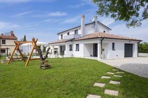 A modern house with a white exterior, a tiled roof, and a well-maintained lawn. - Completely new!!!! Exclusive villa with 4 bedrooms and a private 32 m² pool (ŽMINJ)