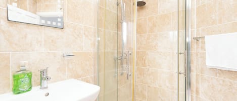 Shower, hair dryer, towels, soap