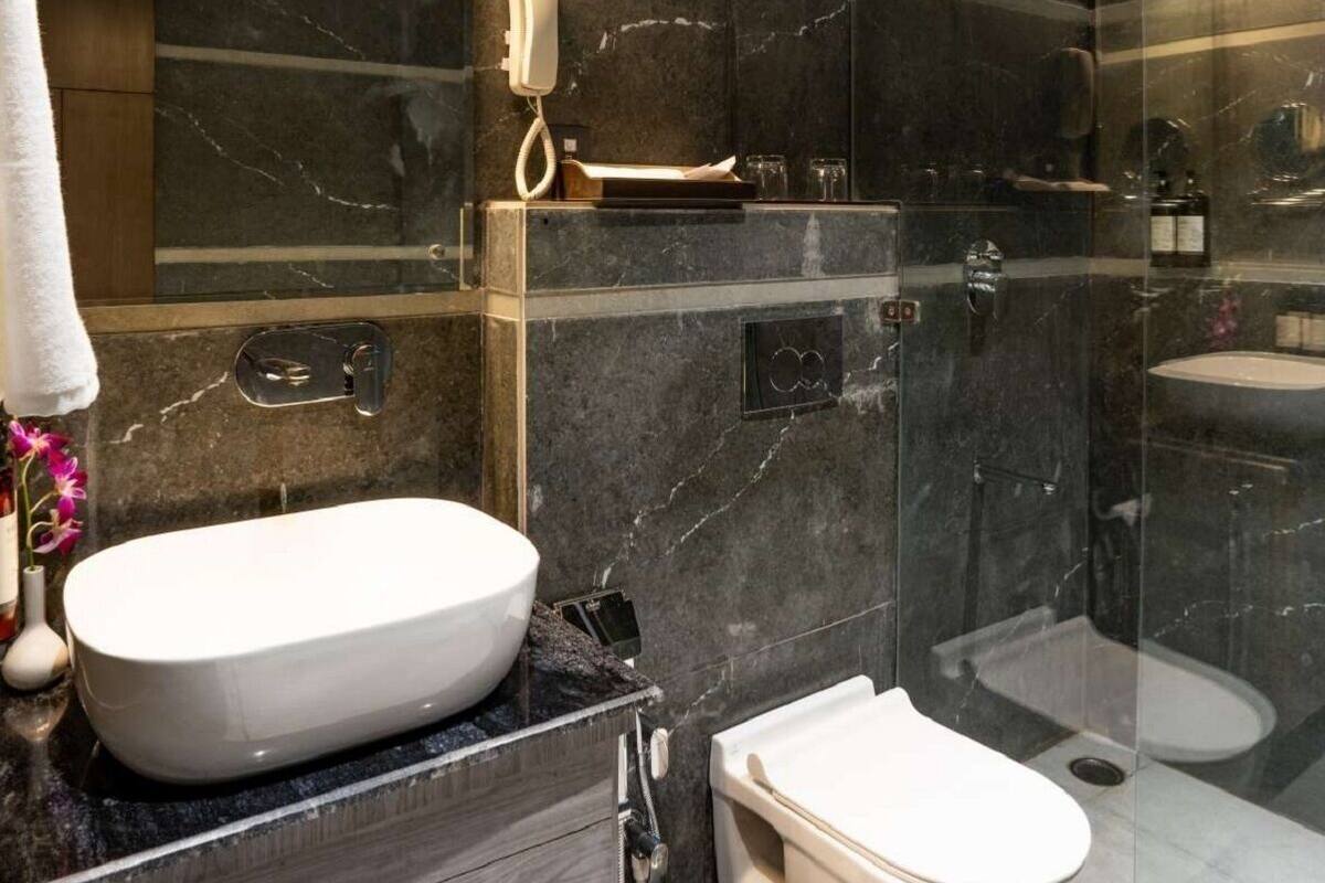 Shower, designer toiletries, hair dryer, bathrobes