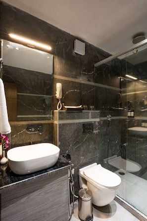 Shower, designer toiletries, hair dryer, bathrobes