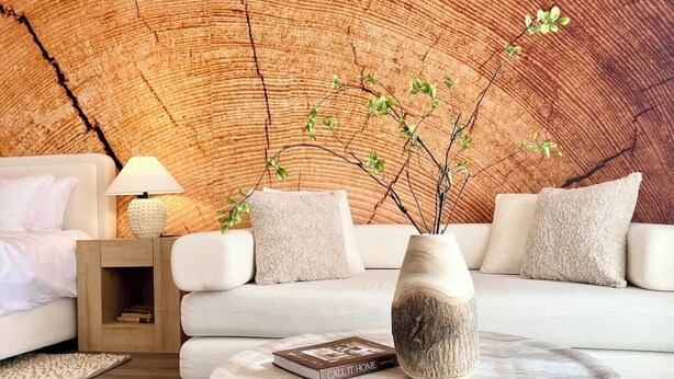 A modern living room with a round coffee table, a white sofa, a wooden side table with a lamp, and a vase with branches. - LUX 6BR/3BA Stylish House w/piano, bar, pool&spa (Las Vegas)