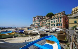 A coastal town with colorful buildings, a marina with covered boats, and a clear blue sky. - 2 bedroom lovely apartment in Genova (Genova)