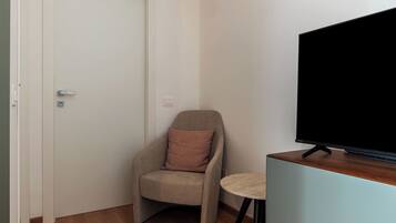 Standard Apartment, 1 Bedroom, Balcony | Living area | 32-inch Smart TV with cable channels