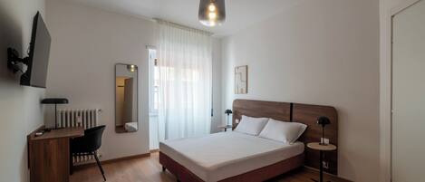 Apartamento conforto, 2 quartos, sacada | Escrivaninha, espaço de trabalho para notebook, Wi-Fi de cortesia