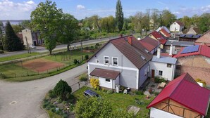 A residential area with houses, a road, and a playground. - Amazing apartment in Nowe Warpno with WiFi (Nowe Warpno)