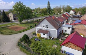 A residential area with houses, a road, and a playground. - Amazing apartment in Nowe Warpno with WiFi (Nowe Warpno)