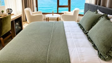 Deluxe Double Room, Sea View | Minibar, in-room safe, desk, laptop workspace