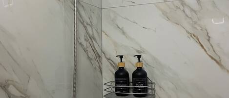Shower, hair dryer, towels, soap