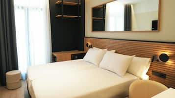 Edredones de plumas, minibar, caja fuerte