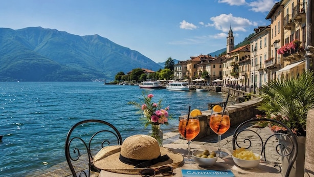 A lakeside table with drinks, a hat, and a book titled 'CANNOBIO.' - 2 min to Lake Maggiore | Modern & Central (Cannobio)