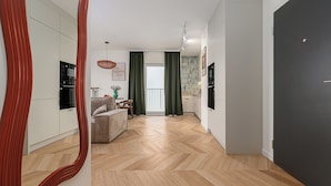 A modern apartment with a kitchen, dining area, and living room. - ShortStayPoland Szwedzka B196 (Warszawa)