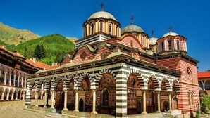A historic building with multiple domes, arches, and a courtyard. - Exclusive Stay Inside the Rila Monastery (Rila)