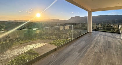 Upper floor of a villa with a private pool and views of the sea and mountains