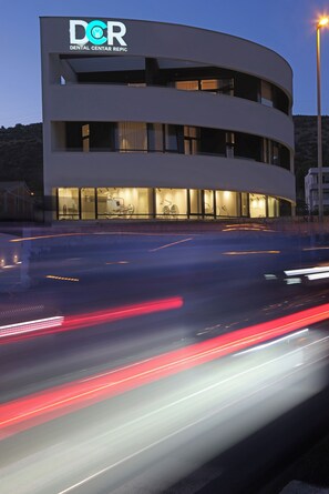 A modern building with a sign reading 'DCR Dental Center Repic.' - Trogir sky view suite (Trogir)