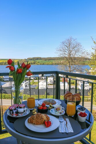 Design-FeWo at the Möhnesee with unique lake view, balcony, pool, sauna, elevator