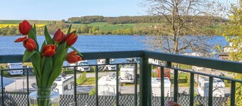 Design-FeWo at the Möhnesee with unique lake view, balcony, pool, sauna, elevator