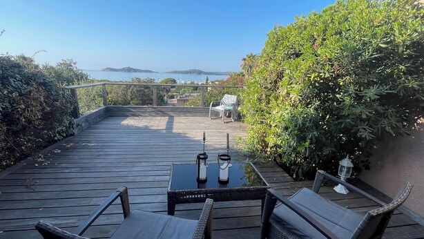 A wooden deck with wicker furniture and a table, overlooking a scenic view. - RESIDENCE PINARELLO CORSE SUD, MINI VILLA, SEA AND BEACH VIEW ON FOOT, for 6 (Zonza)