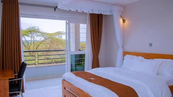 Premium bedding, memory-foam beds, desk, laptop workspace