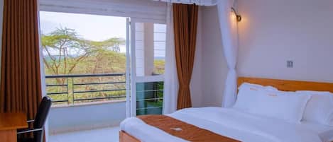 Premium bedding, memory foam beds, desk, laptop workspace