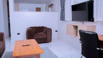 Suite Deluxe, balcon, vue parc | Coin séjour