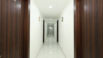 A corridor with doors numbered 204 and 203, leading to rooms.