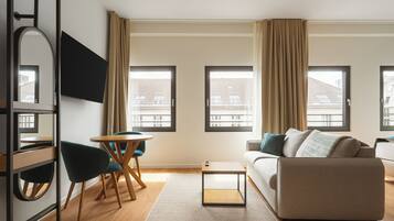 Comfort Suite with sofa bed | Living area | 50-inch flat-screen TV with cable channels