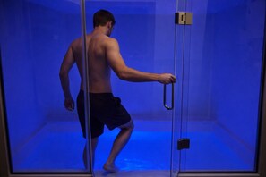 A person in a room with a glass door, a handle, and a metallic lock. - “Exclusive Chateau Estate, for 14 Guests with Pool Near Tongeren” (Tongeren-Borgloon)