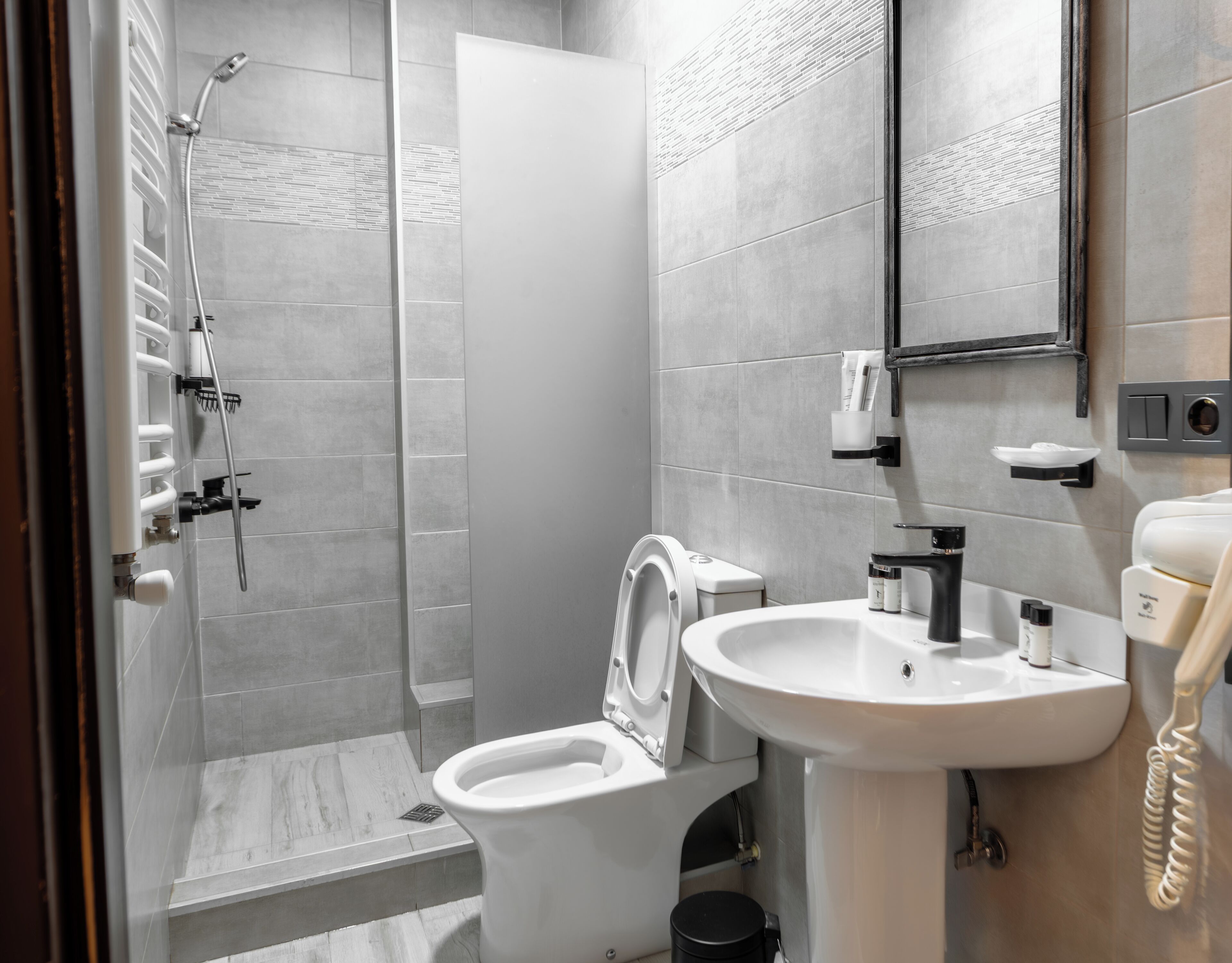 Shower, hair dryer, slippers, towels