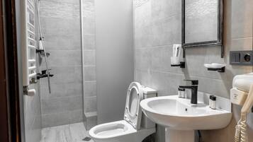 Shower, hair dryer, slippers, towels