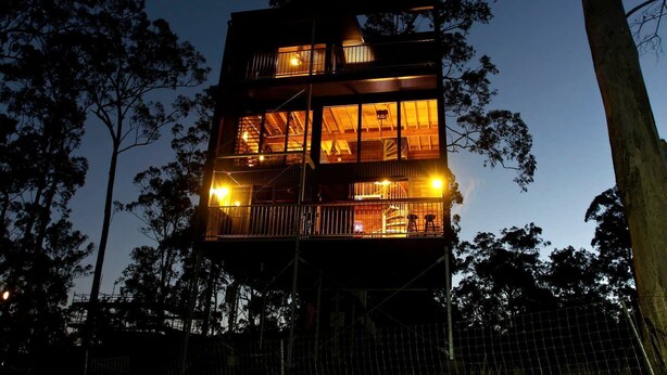 A multi-story tower with balconies, surrounded by trees. - Stunning Tree House with Pool Access Ideal for Luxury Holiday Accommodation, Gold Coast (Gold Coast)