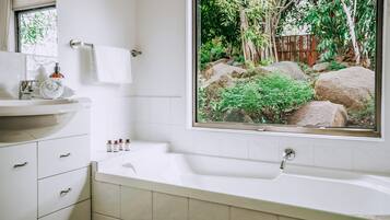 Jetted bath, hair dryer, towels, soap