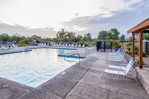 A swimming pool with lounge chairs and a covered area. - San Tan Valley Home w/ Patio in Johnson Ranch! (San Tan Valley)