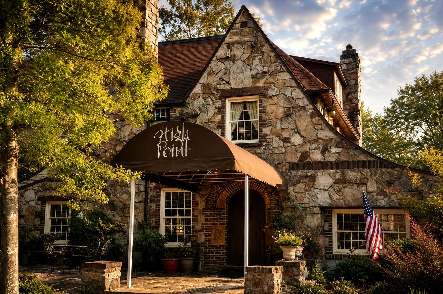 A stone building with a covered entrance labeled 'High Point.'