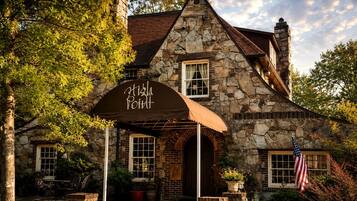 A stone building with a covered entrance labeled 'High Point.'