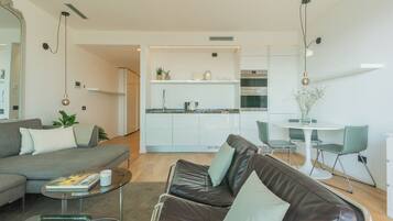 Apartment (1 Bedroom) | Living area | 32-inch TV with cable channels