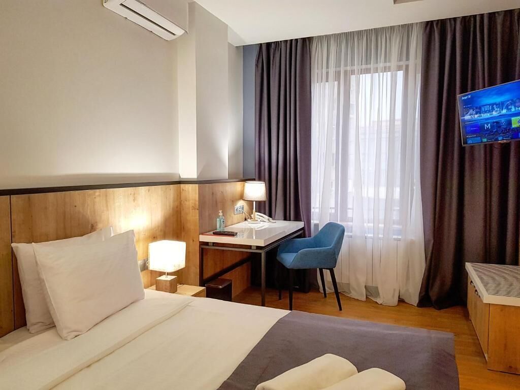 Camera Deluxe con letto matrimoniale o 2 letti singoli, angolo cottura