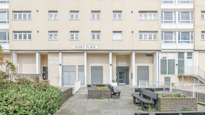 A multi-story building with a sign reading 'ESSEX PLACE' at the entrance. - Host Stay Essex Place (Brighton)