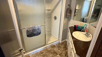 Shower, hair dryer, towels, soap