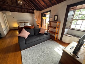 A room with a sofa, a bed, a desk, and a window. - TH - Casa Yerbabuena (Villa de Mazo)