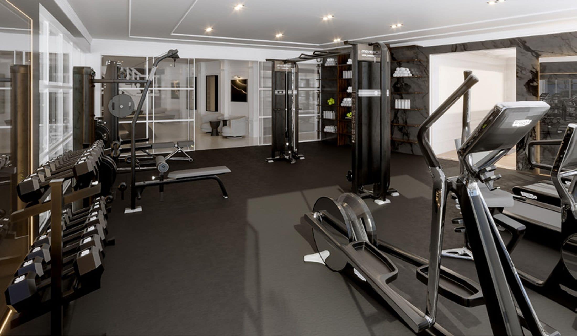 A modern gym with various exercise equipment, including treadmills and weight machines.