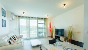 Comfort Apartment, Balcony, Mountain View | Living area | 130-cm LED TV with cable channels