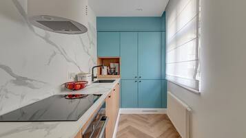 Deluxe Apartment, Balcony, Courtyard View | Private kitchen | Coffee/tea maker, electric kettle, toaster, high chair