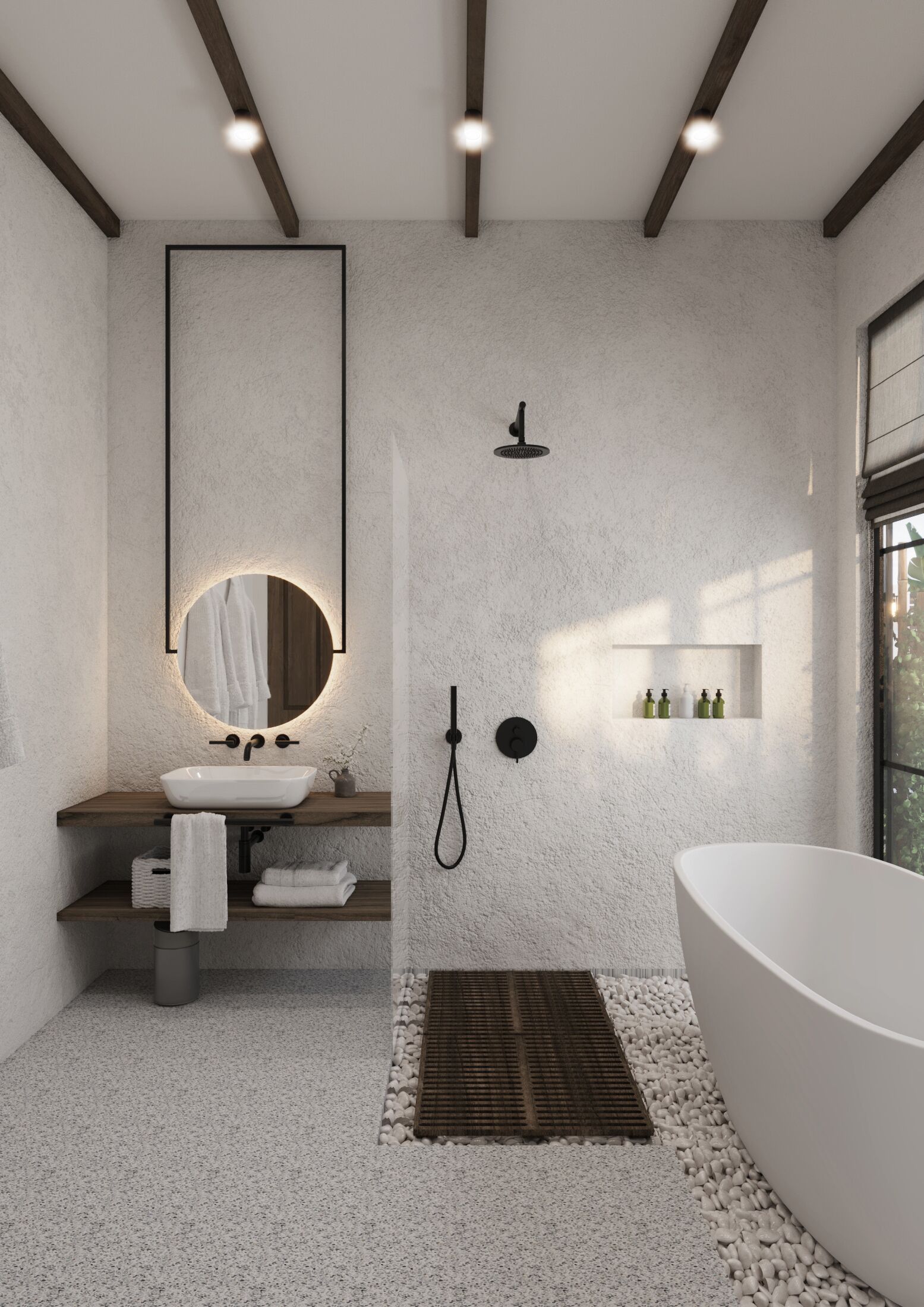 A modern bathroom with a freestanding bathtub, a round mirror, a wall-mounted showerhead, and a shelf with toiletries.