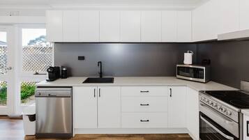 Coffee/tea maker, fridge, microwave, oven