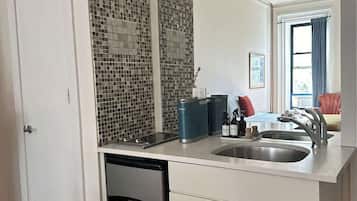 Fridge, stovetop, coffee/tea maker, cookware/dishes/utensils