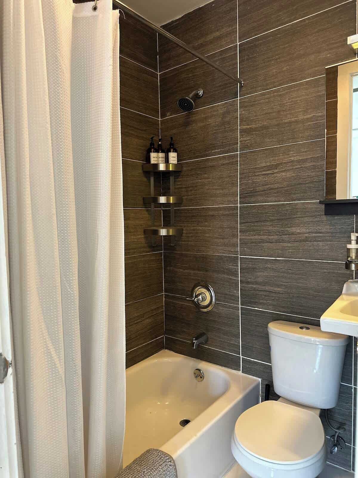 Shower, hair dryer, towels, shampoo