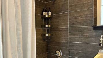 Shower, hair dryer, towels, shampoo