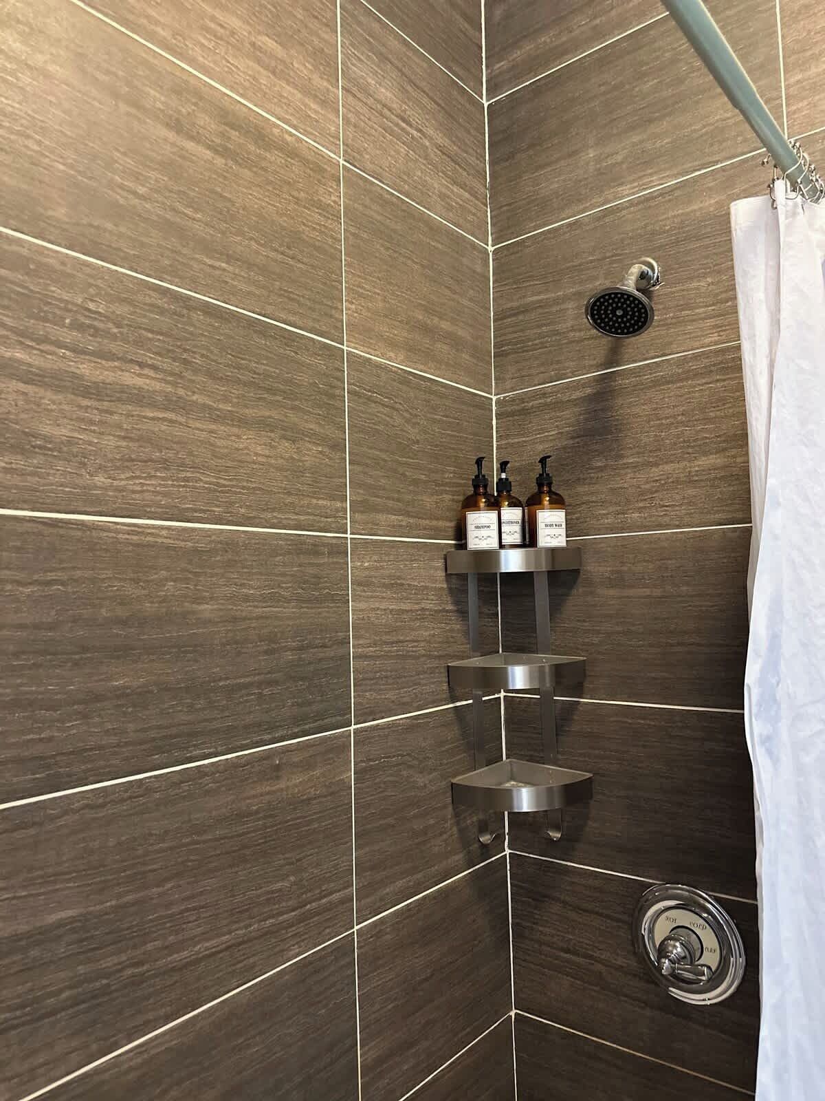 Shower, hair dryer, towels, shampoo